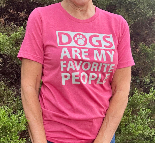Bright Pink tee shirt with white graphic in all capital letters reads DOGS ARE MY FAVORITE PEOPLE