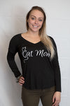 A Black V-neck 100 % cotton long sleeved V neck tee with the words Cat Mom in white ink on shirt front. Cat nose and whiskers are on the shirt back.