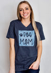 A short sleeve unisex Midnight Navy V-neck tee with DOG MOM graphic in light blue and paw print on front. Additional paw prints on back of shirt. Sizes small to 3X-Large