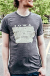 A Dark Grey Heather unisex crew neck short sleeved tee with a graphic of Iowa and the city names in it. Original Scratchpad Tees design.