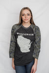 A woman wearing a Dark Grey Heather, Camo sleeved unisex baseball tee with raglan sleeves. On the shirt front is a light grey graphic of the state of Wisconsin and its cities. Sizes small to 3X-Large. A Scratchpad Tees original design.