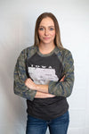 A Scratchpad Tees original design. A Dark grey, Camo, raglan sleeved adult unisex baseball tee with a graphic of Iowa state and most of its cities. Sizes small to 3X-Large