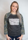 A Dark Grey Heather, Camo sleeved unisex baseball tee with raglan sleeves. Front shirt graphic is Light Grey, showing North Dakota and 98% of it's cities. Sizes small to 3X-Large. A Scratchpad Tees original design.