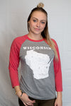 A woman wearing a unisex, light grey baseball tee shirt with red raglan sleeves. On the front is a white graphic of Wisconsin state and its cities .  Available in sizes small to 3X-Large.