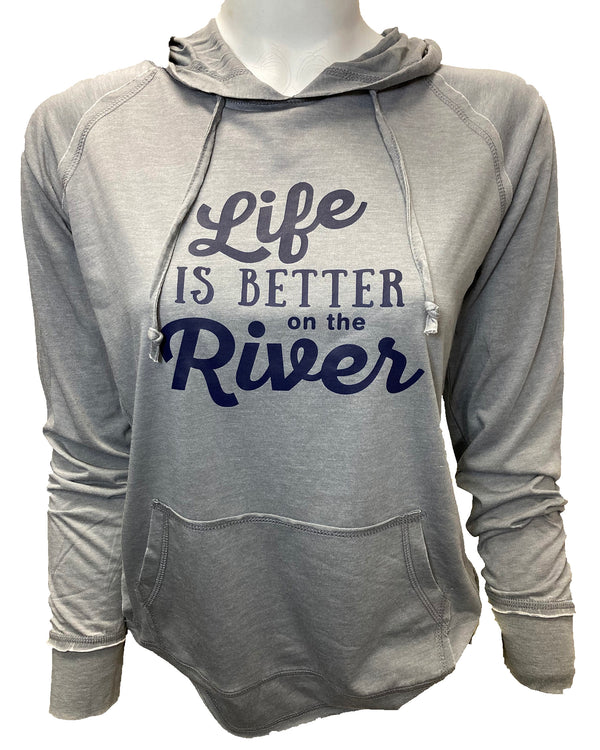 A female mannequin wearing a featherweight, pouch front, hooded long sleeved sweatshirt. This Gunmetal Grey shirt has a playful, dark navy graphic that reads Life Is Better On The  River.