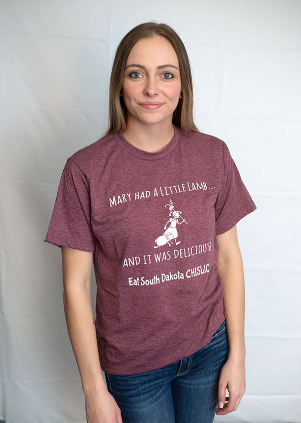Heather Burgundy short sleeved tee with light grey graphic of Mary walking with her little lamb. The design reads Mary Had A Little Lamb, It Was Delicious. Eat South Dakota Chislic.                     