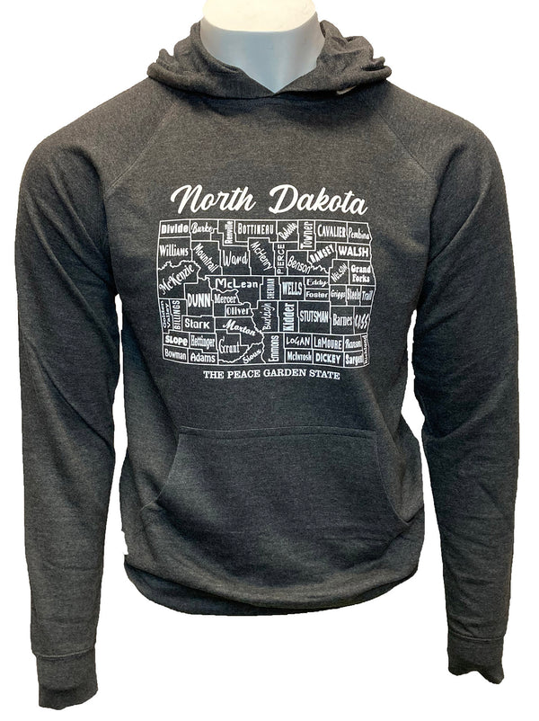 A male mannequin wearing a Charcoal Heather, unisex, pouch front hooded sweatshirt. The white front graphic is a map of North Dakota's counties, name. Wording reads North Dakota, The Peace Garden state. Available in sizes Small to 3 X-Large