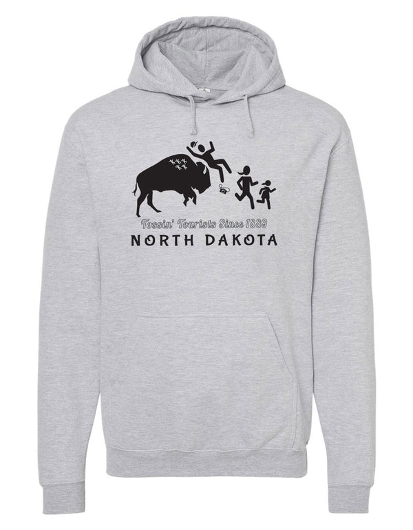 A mock up of a Heather Grey hooded, pouch front sweatshirt. The front graphic includes a charging buffalo launching a tourist family up in the air. The caption reads; Tossin' Tourists since 1889 in North Dakota.