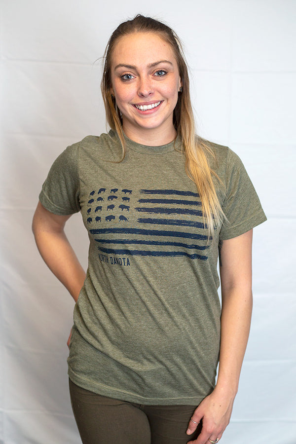A Heather Military Green unisex crew neck tee shirt. The Navy colored front graphic resembles the U.S. flag with images of grazing Bison in the stars field. The words North Dakota are placed directly under the graphic.