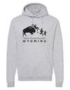 A mock up of a Heather Grey hooded, pouch front sweatshirt. The front graphic includes a charging buffalo launching a tourist family up in the air. The caption reads; Tossin' Tourists since 1890 in Wyoming.